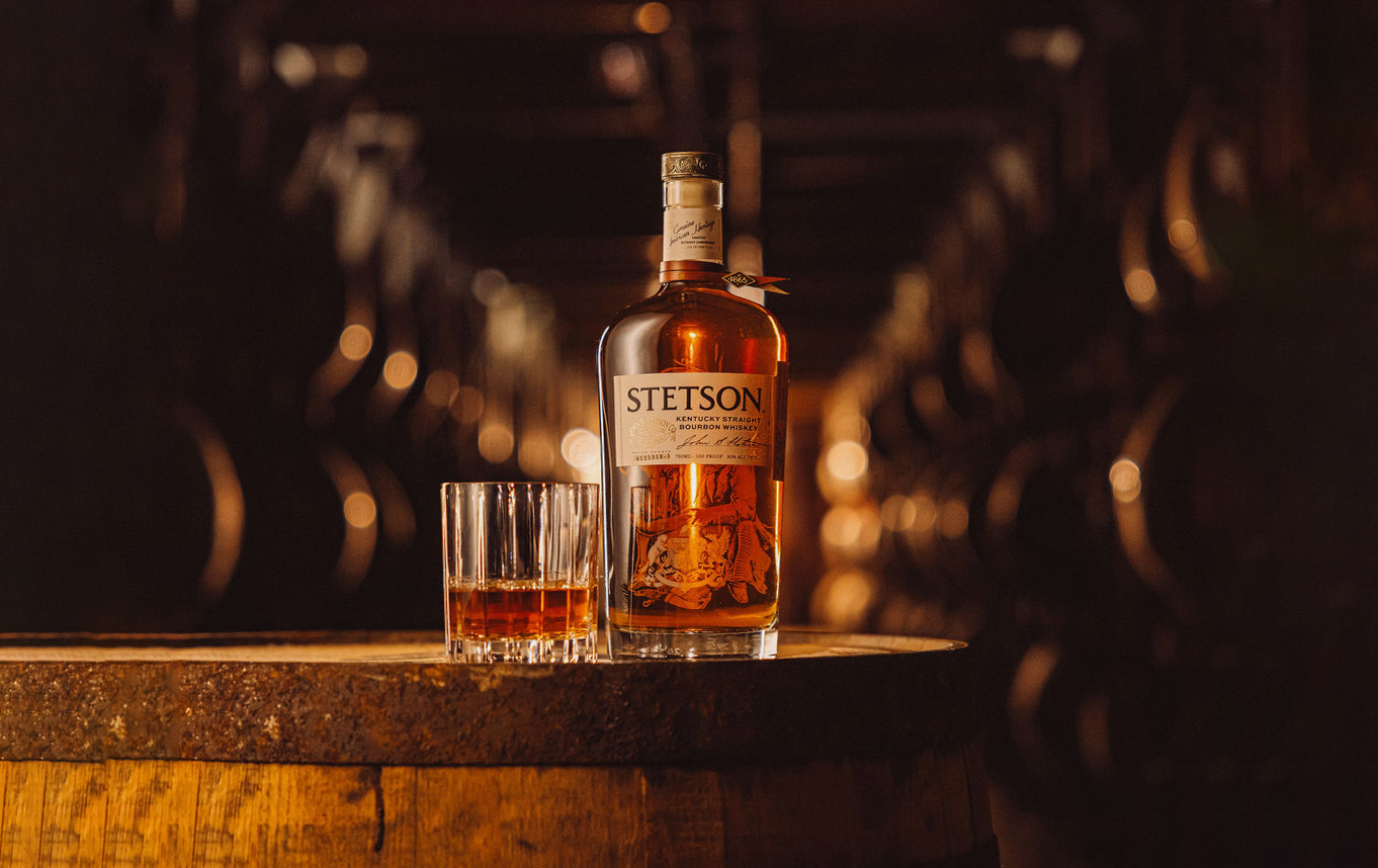 Stetson Bourbon bottle on a barrel