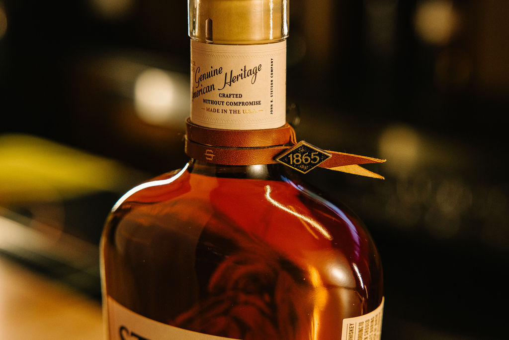 Stetson Bourbon glass on a barrel