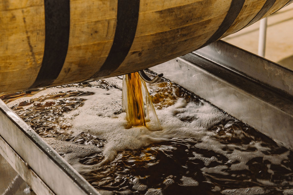 Dumping a bourbon barrel